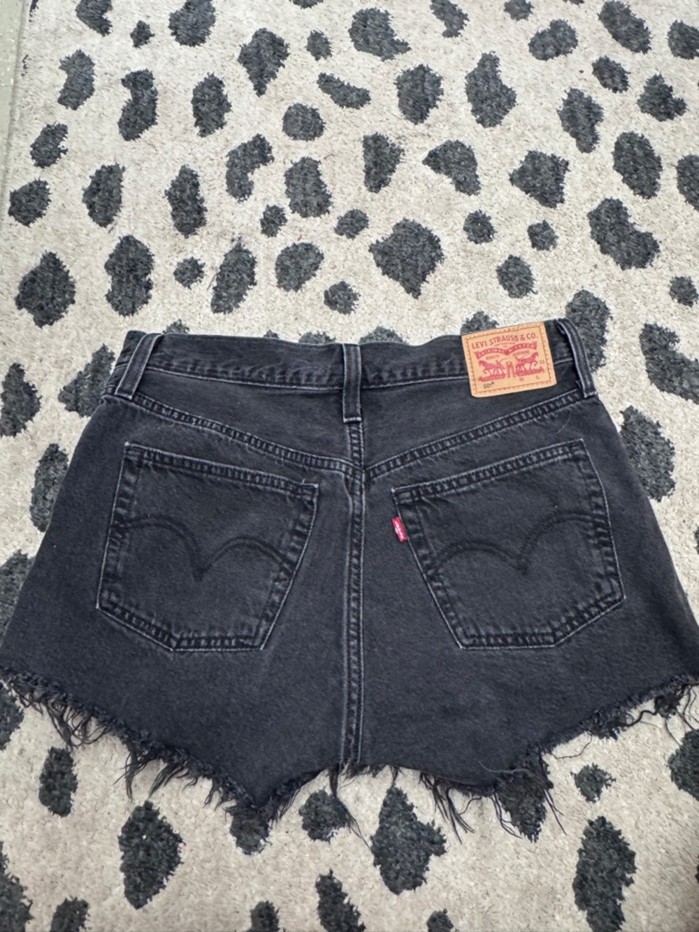 Levi's Black Denim Raw Hem Cutoff Shorts
